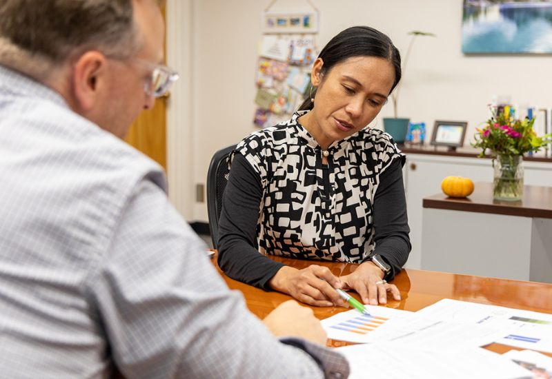 picture of superintendent examining budget documenets